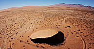 Devils Throat Amid Vast Desert